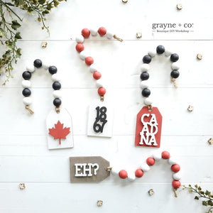 
                
                    Load image into Gallery viewer, Grayne &amp;amp; Co. Tiered Tray Kits Mini Tag Garland DIY Kit - CANADA DAY Edition
                
            